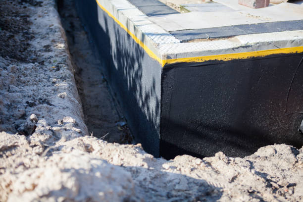 Professional Waterproofing technician working in East Lansing, MI